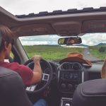 man driving straight on pathway during day time
