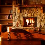 brown wooden table with white pillar candles