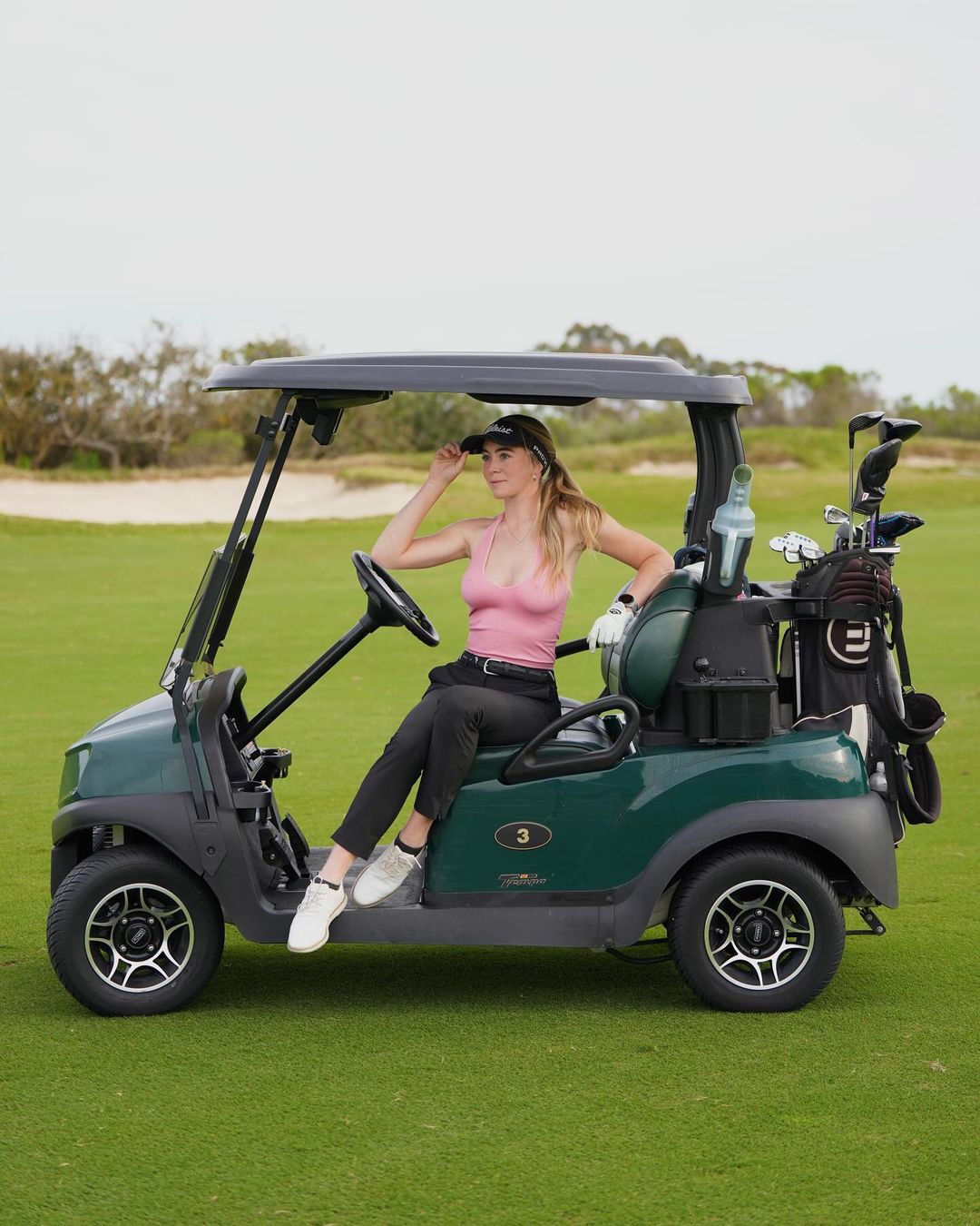 Grace charis in a golf cart